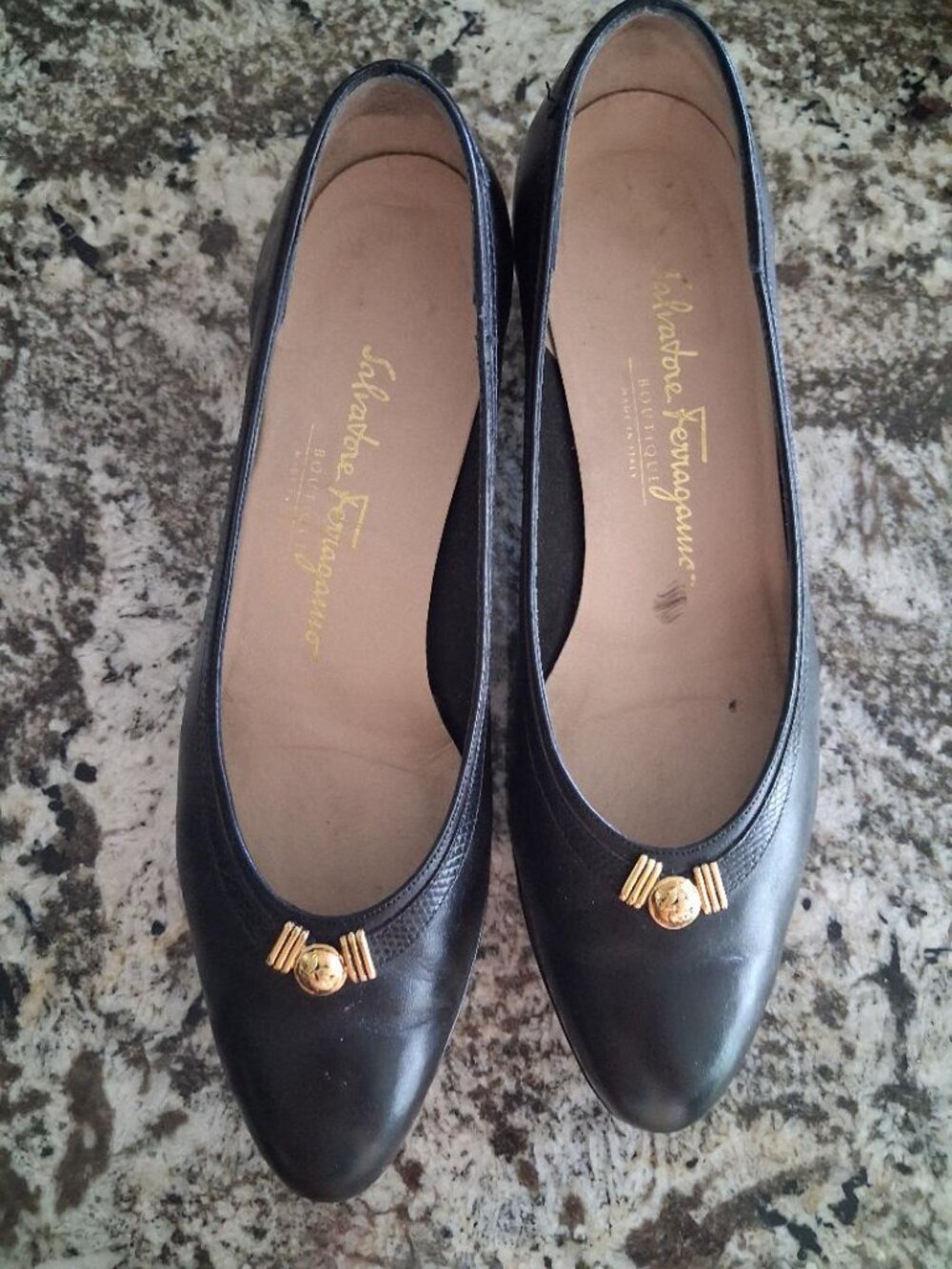 Salvatore Ferragamo navy blue leather pumps with gold button accents in  size 8B
